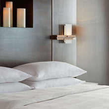 Load image into Gallery viewer, Levo LED Wall Light in bedroom.
