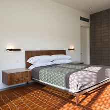 Load image into Gallery viewer, Levo LED Wall Light in bedroom.
