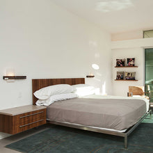 Load image into Gallery viewer, Levo LED Wall Light in bedroom.
