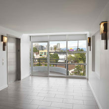 Load image into Gallery viewer, Oris LED Wall Light in hallway.
