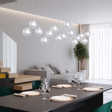 Load image into Gallery viewer, Champagne Bubbles LED Pendant Light in dining room.
