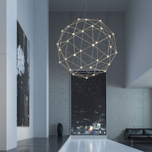 Load image into Gallery viewer, Constellation® Hedron LED Pendant Light in living room.
