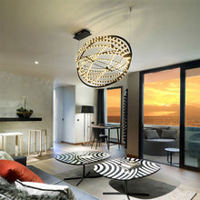 Load image into Gallery viewer, Copernico LED Suspension Light in living room.
