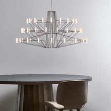 Load image into Gallery viewer, Coppelia LED Chandelier in dining room.

