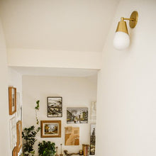 Load image into Gallery viewer, Cora Wall Light in living room.
