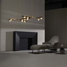 Load image into Gallery viewer, Modulo Grid Linear LED Pendant Light in living room.
