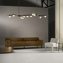 Load image into Gallery viewer, Modulo Grid Linear LED Pendant Light in living room.
