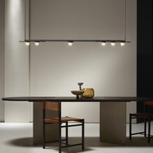 Load image into Gallery viewer, Modulo Linear LED Pendant Light in living room.
