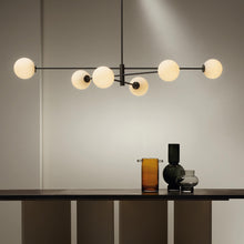 Load image into Gallery viewer, Trevi Pendant Light in dining room.
