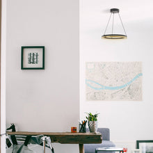 Load image into Gallery viewer, Eclipse LED Pendant Light in living room.

