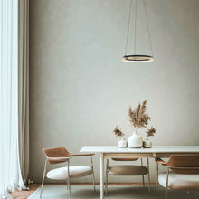 Load image into Gallery viewer, Eclipse LED Pendant Light in living room.
