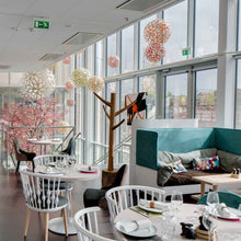 Load image into Gallery viewer, Floral Pendant Light in restaurant.

