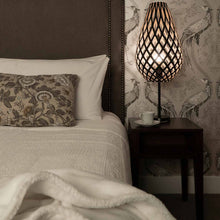 Load image into Gallery viewer, Koura Table Lamp in bedroom.
