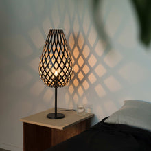 Load image into Gallery viewer, Koura Table Lamp in bedroom.
