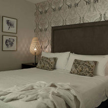 Load image into Gallery viewer, Koura Table Lamp in bedroom.
