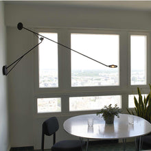 Load image into Gallery viewer, Aaro LED Wall Light in dining room.
