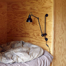 Load image into Gallery viewer, Lampe Gras N°210 Swing Arm LED Wall Light in bedroom.
