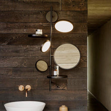 Load image into Gallery viewer, Tell Me Stories LED Wall Light in bathroom.
