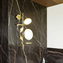 Load image into Gallery viewer, Tell Me Stories LED Wall Light in bathroom.
