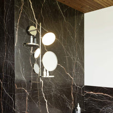 Load image into Gallery viewer, Tell Me Stories LED Wall Light in bathroom.
