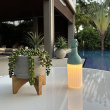 Load image into Gallery viewer, ELO Nomad Portable Outdoor LED Table Lamp in Outdoor area.
