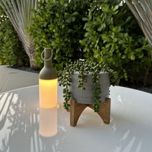 Load image into Gallery viewer, ELO Nomad Portable Outdoor LED Table Lamp in Outdoor area.
