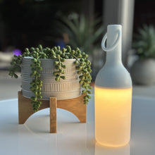 Load image into Gallery viewer, ELO Nomad Portable Outdoor LED Table Lamp in Outdoor area.
