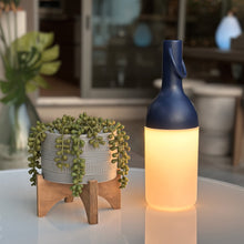 Load image into Gallery viewer, ELO Nomad Portable Outdoor LED Table Lamp in Outdoor area.
