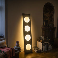 Load image into Gallery viewer, Dolmen LED Floor Lamp in living room.
