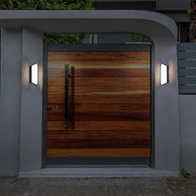 Load image into Gallery viewer, Corte Outdoor LED Wall Light in Outside area.
