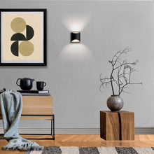 Load image into Gallery viewer, Duet LED Wall Light in living room.
