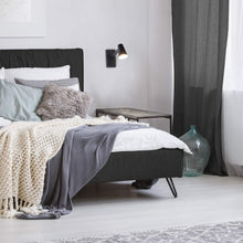Load image into Gallery viewer, Grisham LED Swing Arm Wall Light in bedroom.
