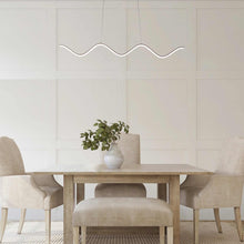 Load image into Gallery viewer, Morae LED Pendant Light in living room.
