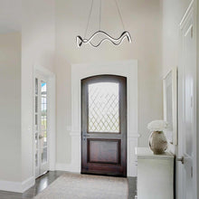 Load image into Gallery viewer, Morae LED Pendant Light in living room.
