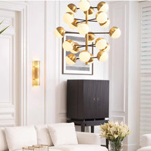Load image into Gallery viewer, Cona Chandelier in living room.
