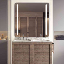 Load image into Gallery viewer, Bela LED Lighted Mirror in bathroom.
