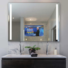 Load image into Gallery viewer, Integrity LED Lighted Mirror TV in bathroom.
