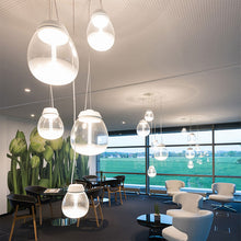 Load image into Gallery viewer, Empatia LED Suspension Light in living room.
