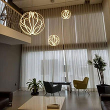 Load image into Gallery viewer, Aura Pendant LED Light in living room.
