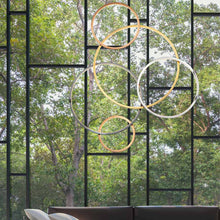 Load image into Gallery viewer, Union LED Multi-Light Pendant Light in living room.
