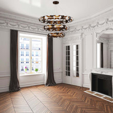 Load image into Gallery viewer, Banderia LED Multi Tier Chandelier in living room.
