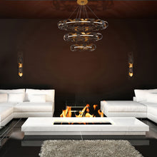 Load image into Gallery viewer, Banderia LED Multi Tier Chandelier in living room.
