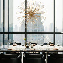 Load image into Gallery viewer, Dendelio Chandelier in living room.
