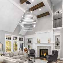 Load image into Gallery viewer, Forster LED Multi Tier Chandelier in living room.
