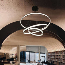 Load image into Gallery viewer, Forster LED Multi Tier Chandelier in library.
