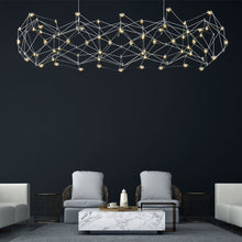 Load image into Gallery viewer, Leonardelli LED Chandelier in living room.
