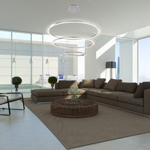 Load image into Gallery viewer, Spunto LED Multi Tier Chandelier in living room.
