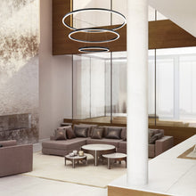 Load image into Gallery viewer, Spunto LED Multi Tier Chandelier in living room.
