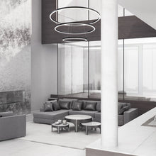 Load image into Gallery viewer, Spunto LED Multi Tier Chandelier in living room.
