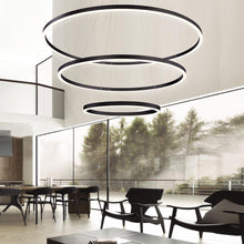 Load image into Gallery viewer, Spunto LED Multi Tier Chandelier in living room.

